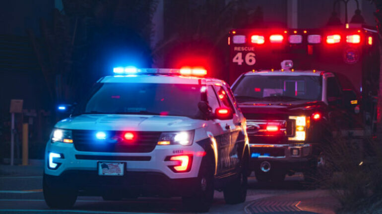 American,police,car,and,emergency,truck,with,blue,and,red
