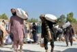 People Carry Relief Supplies Donated By World Food Programme In Kandahar Afghanistan. Photo By Sanaullah Seiamxinhuaians