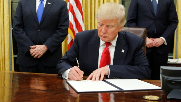 Trump, Flanked By Kushner, Pence And Porter, Welcomes Reporters Into The Oval Office For Him To Sign His First Executive Orders At The White House In Washington