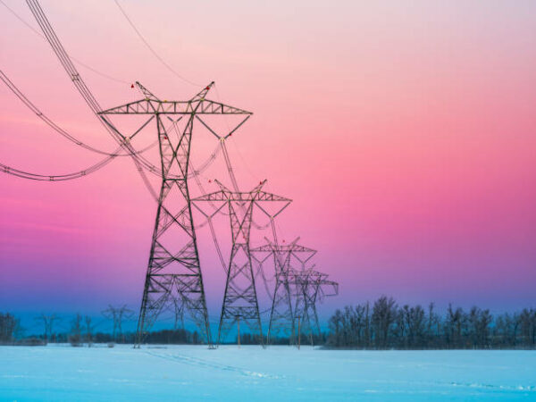 Sunrise Of Prairie With Power Line In Winter, Alberta, Canada.